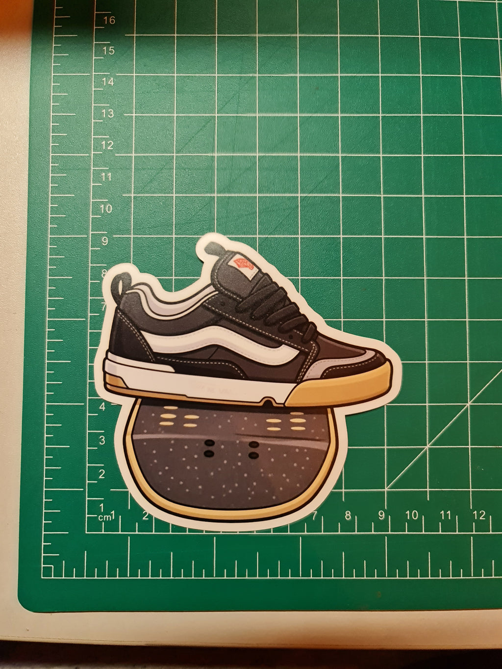 Vans on a skate deck sticker